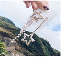 Fashion Simple Rhinestone Pearl Tassel Asymmetric Star Stud Earrings main image 1