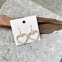 Ins Style Cute Exaggerated Star Heart Alloy Stoving Varnish Plating Inlaid Pearls No Inlaid Women's Earrings main image 1