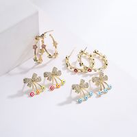 Fashion New Copper Plating 18k Gold Micro Inlaid Zircon Bow Geometric Ear Studs Devil's Eye C-shaped Earring main image 1