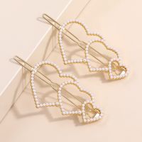 2022 New Fashion Elegant Pearl Inlaid Heart-shaped Bang Side Hairpin main image 1