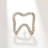 2022 New Fashion Creative Hollow Tooth Shape Rhinestone Inlaid Alloy Brooch main image 1