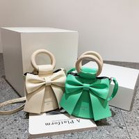 2022 أزياء ربيع جديد الإناث اسطوانة الرجعية صغيرة الكتف Crossbody Bowknot حقيبة main image 4