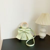 2022 أزياء ربيع جديد الإناث اسطوانة الرجعية صغيرة الكتف Crossbody Bowknot حقيبة sku image 2