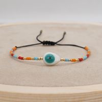 Pulsera De Cuentas De Colores Tejida A Mano Con Cuentas De Arroz De Ojos Afortunados De Concha Natural Simple sku image 6