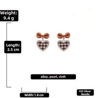 925 Silver Needle Vintage Pearl Fabric Love Heart Bow Tie Earrings European And American Ins Simple Autumn And Winter Check Graceful Earrings sku image 4