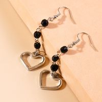 Simple Style Long Gland Perles Creux Pendentif Coeur Boucles D'oreilles main image 2