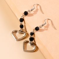 Simple Style Long Tassel Beads Hollow Heart Pendant Earrings main image 2