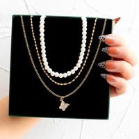 Fashion Creative Zircon Inlaid Butterfly Pendant Pearl Three-layer Necklace Female main image 1