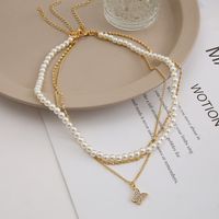 Fashion Creative Zircon Inlaid Butterfly Pendant Pearl Three-layer Necklace Female main image 6