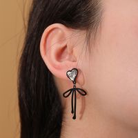 Fashion Simple Heart Shape Crystal Inlaid Bow Alloy Ear Stud main image 1
