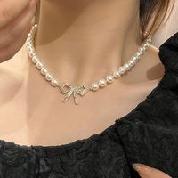 Sommer Mode Weibliche Vintage Perle Bogen Anhänger Kupfer Choker Kragen Weibliche main image 1