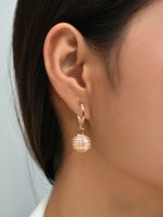 Korean Fashion Simple Round Hollow Earrings Stainless Steel Pearl Earrings Peach Pit-shaped Earclip Earrings main image 3