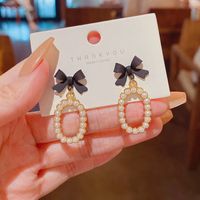 New Fashion Bow Inlaid Pearl Alloy Drop Earrings main image 1