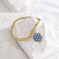 New Style Copper Plated 18k Gold Zirconia Oil Drop Blue Eye Flower Bracelet main image 3