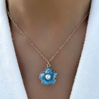 Fashion Blue Drop Oil Pearl Inlaid Small Five-petal Flower Necklace main image 1