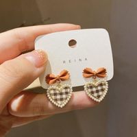 New Fashion Pearl Plaid Heart Shaped Bow Alloy Stud Earrings sku image 2