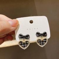 New Fashion Pearl Plaid Heart Shaped Bow Alloy Stud Earrings main image 4