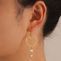 Fashion Simple Hollow Heart-shaped Metal Geometry Pearl Earrings main image 1