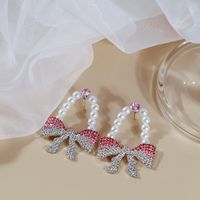 Fashion Inlay Strass Künstliche Perle Voll-jeweled Bogen Ohrringe main image 4