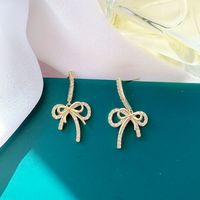 Simple Style Bow Shape Tassel Copper Inlaid Zircon Earrings main image 1