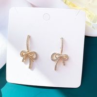 Simple Style Bow Shape Tassel Copper Inlaid Zircon Earrings main image 3