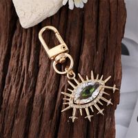 Fashion Alloy Inlaid  Rhinestone Eye Shaped Keychain Electroplated Gold Handbag Pendant main image 2