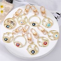 Fashion Alloy Hollow Dripping Keychain Round Geometric Blue Eyes Bag Pendant Accessories main image 6