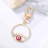Fashion Alloy Hollow Dripping Keychain Round Geometric Blue Eyes Bag Pendant Accessories main image 4