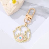 Fashion Alloy Hollow Dripping Keychain Round Geometric Blue Eyes Bag Pendant Accessories sku image 1