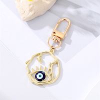 Fashion Alloy Hollow Dripping Keychain Round Geometric Blue Eyes Bag Pendant Accessories sku image 4