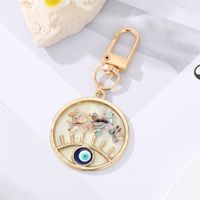 Fashion Alloy Hollow Dripping Keychain Round Geometric Blue Eyes Bag Pendant Accessories sku image 9