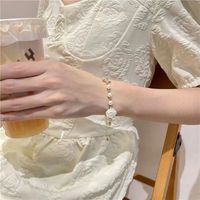 Fashion New Style Hollow Butterfly Inlaid Rhinestone Camellia Flower Pearl Bracelet main image 3