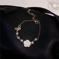 Fashion New Style Hollow Butterfly Inlaid Rhinestone Camellia Flower Pearl Bracelet main image 4