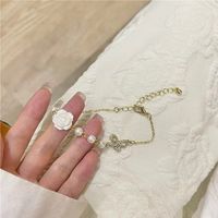 Fashion New Style Hollow Butterfly Inlaid Rhinestone Camellia Flower Pearl Bracelet main image 6