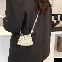 Solid Color Pvc Rhinestone Metal Buckle Open Bucket Type Flower Shoulder Strap Hollow Out Short Handheld Pearl Flower Shoulder Strap Big Pearl Shoulder Bags main image 3