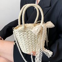 Women's Straw Solid Color Vacation Fashion Pearl Bowknot Bucket Shape Zipper Handbag Crossbody Bag sku image 1