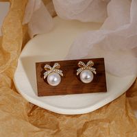 Women's Sweet Bow Knot Alloy Rhinestones Earrings Pearl Metal Diamond Stud Earrings main image 1