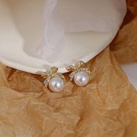 Women's Sweet Bow Knot Alloy Rhinestones Earrings Pearl Metal Diamond Stud Earrings main image 2