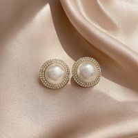 Fashion Solid Color Alloy Plating Inlay Artificial Pearls Rhinestone Ear Studs main image 1