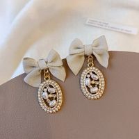 Elegant Bow Knot Inlay Alloy Pearl Drop Earrings sku image 1