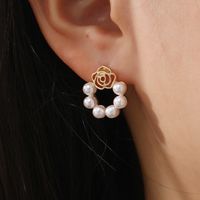 Sweet Flower Alloy Hollow Out Pearl Women's Ear Studs 1 Pair main image 1