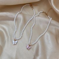 Simple Style Bow Knot Imitation Pearl Inlay Shell Necklace main image 1