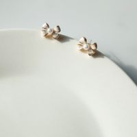 Simple Style Bow Knot Alloy Enamel Artificial Pearls Ear Studs sku image 1