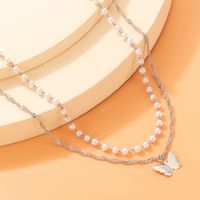 Simple Style Butterfly Alloy Artificial Pearls Women's Layered Necklaces main image 7