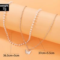 Simple Style Butterfly Alloy Artificial Pearls Women's Layered Necklaces main image 4