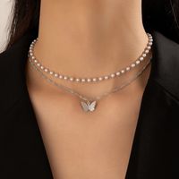 Simple Style Butterfly Alloy Artificial Pearls Women's Layered Necklaces main image 1