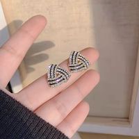 1 Pair Simple Style Shiny Triangle Hollow Out Inlay Copper Zircon Ear Studs main image 1