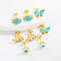 Estilo Clásico Ojo Del Diablo Mariposa Cobre Esmalte Chapado En Oro Circón Pendientes 1 Par main image 1