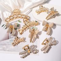 Women's Fashion Letter Bow Knot Alloy Plating Inlay Artificial Pearls Artificial Diamond Hair Claws main image 1