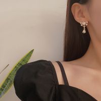 1 Pair Simple Style Heart Shape Alloy Inlay Artificial Pearls Zircon Women's Drop Earrings main image 2
